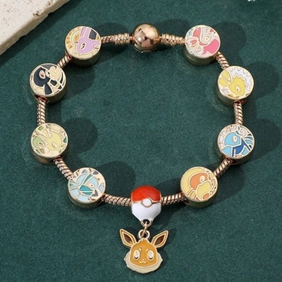 ⭐️NEW⭐️ Gold Plated & Enameled Pokémon Eevee Eeveelution Themed Charm Bracelet - Picture 8 of 8